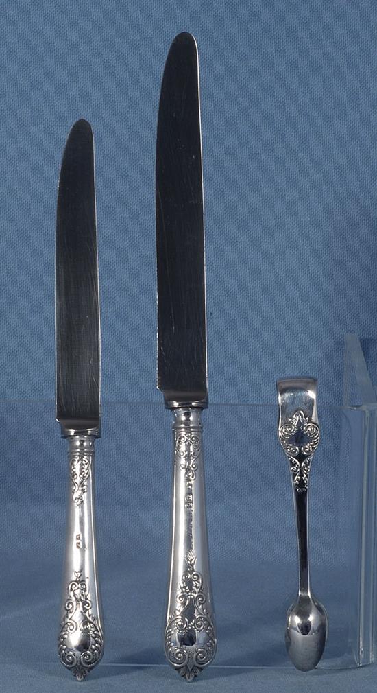 A George V silver canteen of 17th century style lace back trefid pattern cutlery, 110oz/ 3430 grams.